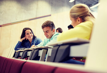 Image showing group of students with notebooks at lecture hall