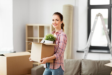 Image showing happy woman with stuff moving to new home