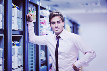 Image showing young it engeneer in datacenter server room