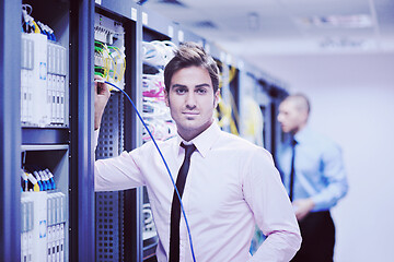 Image showing it engineers in network server room