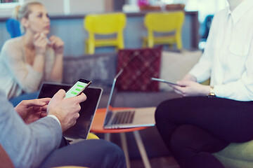 Image showing Young casual businessman using smartphone