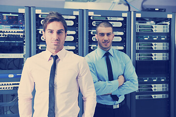 Image showing it enineers in network server room