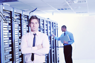 Image showing it engineers in network server room