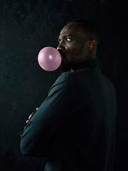 Image showing The african american man with bubble gum