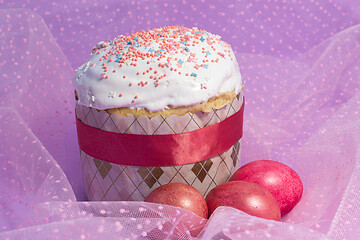 Image showing Easter cake decorated with pink decor and rose-colored eggs