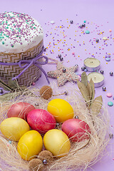 Image showing vertical photo of Easter attributes in yellow-pink tones