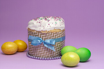 Image showing Easter cake pattern with blue ribbon and yellow-green eggs