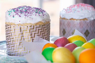 Image showing Two Easter cakes and colorful eggs closeup