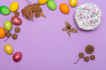 Image showing location of Easter cake and painted eggs on a lilac background