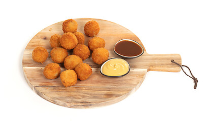 Image showing Dutch traditional snack bitterbal on a serving board