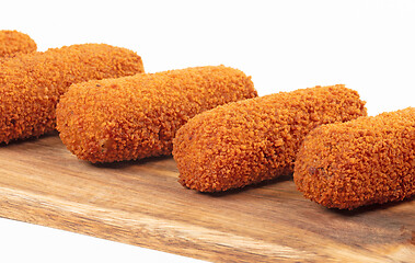 Image showing Brown crusty dutch kroketten on a serving tray, selective focus