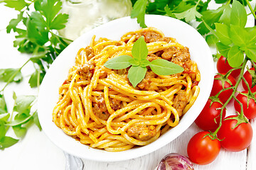 Image showing Spaghetti with bolognese in plate on board