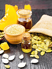 Image showing Oil pumpkin in vial with flour on board