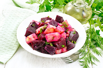 Image showing Salad of beets and potatoes in plate on white board