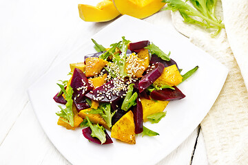 Image showing Salad of pumpkin and beetroot in plate on white board