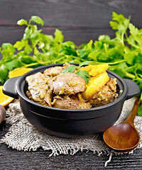 Image showing Liver with oranges in pan on burlap