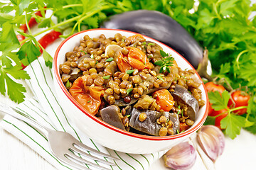 Image showing Lentils with eggplant in bowl on white board