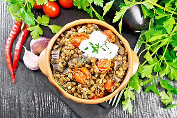 Image showing Lentils with eggplant and tomatoes in bowl on black board top