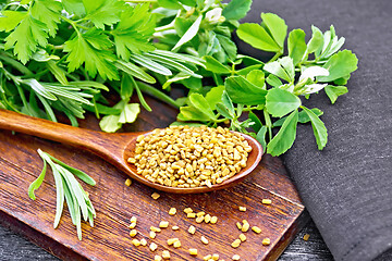 Image showing Fenugreek in spoon with herbs on black board