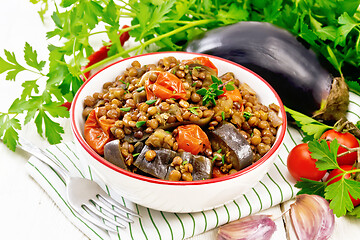 Image showing Lentils with eggplant in bowl on napkin