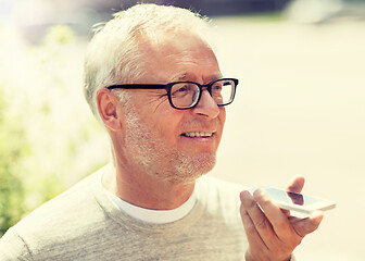 Image showing old man using voice command recorder on smartphone