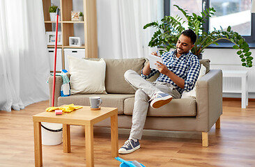 Image showing indian man making to do list after home cleaning