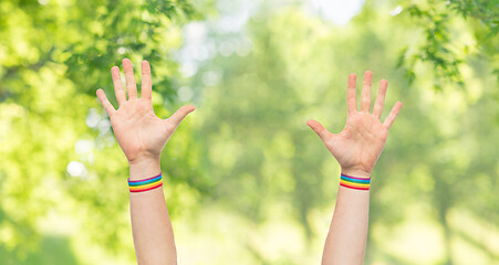 Image showing hands with gay pride rainbow wristbands