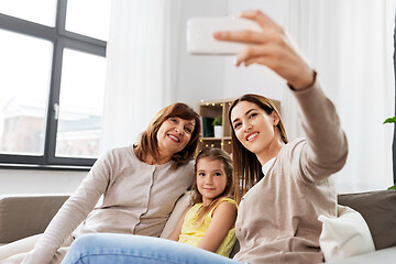 Image showing mother, daughter and grandmother taking selfie