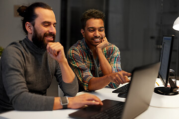 Image showing creative team with computer working late at office