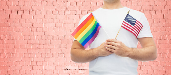 Image showing man with gay pride rainbow flag and wristband