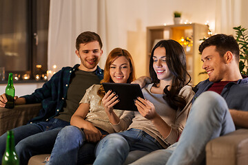 Image showing friends with tablet computer drinking beer at home