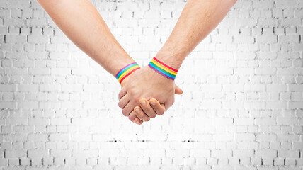 Image showing hands of couple with gay pride rainbow wristbands