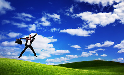 Image showing Jumping business man on Green Field
