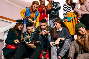 Image showing The group of cheerful happy students sitting in a lecture hall before lesson