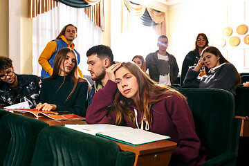 Image showing The group of cheerful happy students sitting in a lecture hall before lesson