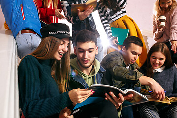 Image showing The group of cheerful happy students sitting in a lecture hall before lesson