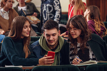 Image showing The group of cheerful happy students sitting in a lecture hall before lesson