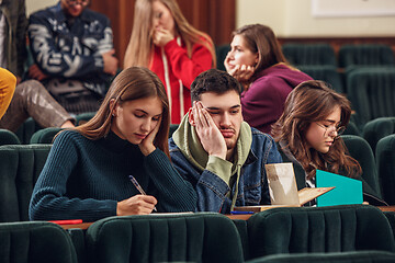 Image showing The group of cheerful happy students sitting in a lecture hall before lesson