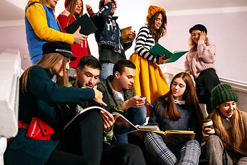 Image showing The group of cheerful happy students sitting in a lecture hall before lesson