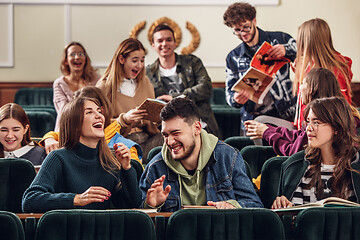 Image showing The group of cheerful happy students sitting in a lecture hall before lesson