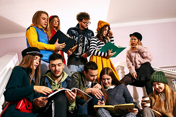 Image showing The group of cheerful happy students sitting in a lecture hall before lesson