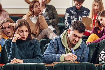 Image showing The group of cheerful happy students sitting in a lecture hall before lesson