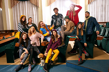 Image showing The group of cheerful happy students sitting in a lecture hall before lesson