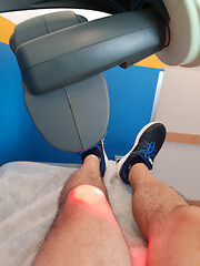 Image showing Physical therapy using a laser to treat an injured knee