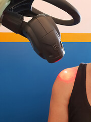 Image showing Physical therapy using a laser to treat an injured shoulder