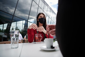 Image showing business people wearing protective mask