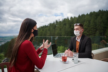 Image showing business people wearing protective mask