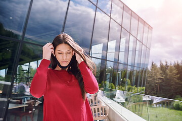 Image showing business woman portrait  with protective mask