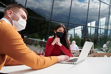 Image showing business people wearing protective mask