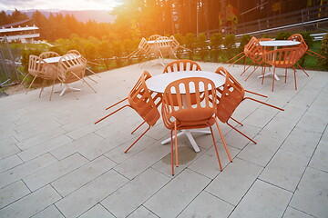 Image showing restaurant tables and chairs at outdoor sitting at restaurant  d